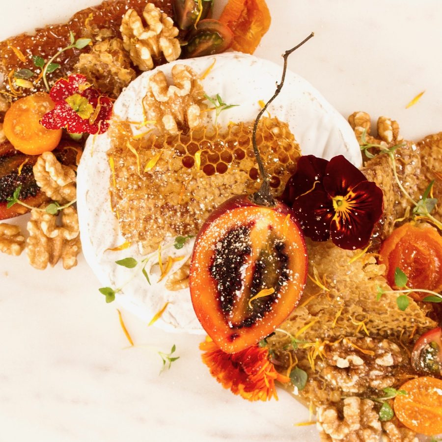 Baked brie with honeycomb, figs and edible flowers — gluten-free grazing at chef level