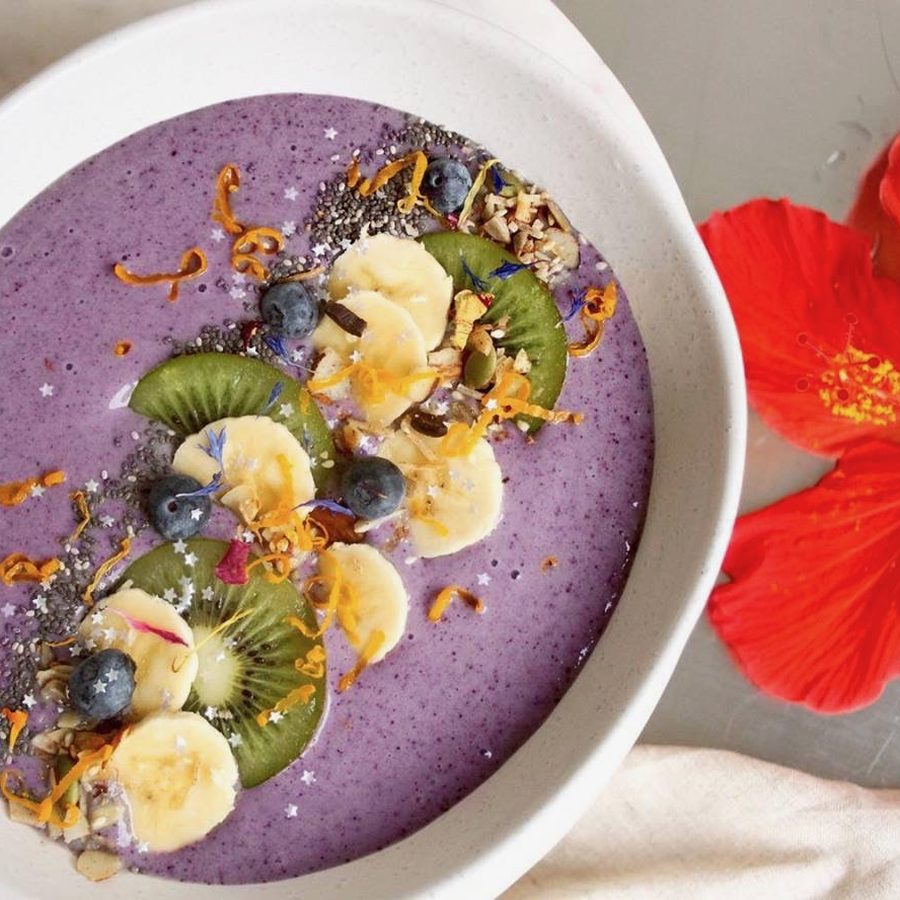 Purple smoothie bowl with kiwi, banana and hibiscus